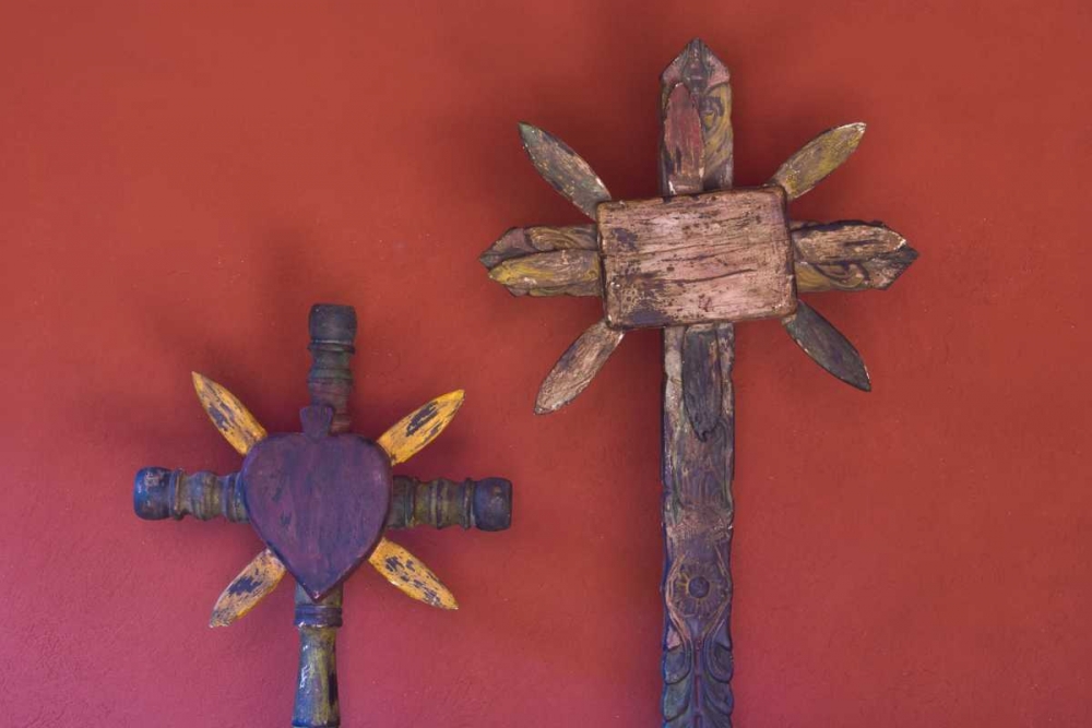 Mexico Two wooden crosses against red wall